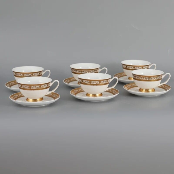 Tea cups and saucers made of new bone china with gold trim. Twelve Pieces for Six People.