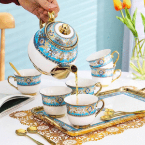 14 piece white and gold ceramic tea set with pot and cups