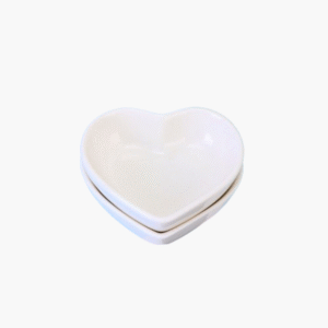 Two white ceramic heart shaped dip bowls