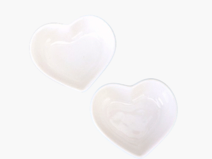 2 pieces of decorative ceramic heart-shaped dip bowls.
