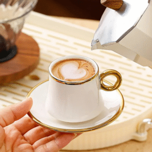 Six white and gold ceramic tea cups and saucers in a gift box