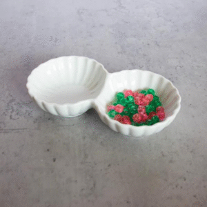 Round decorated white two section porcelain serving bowls