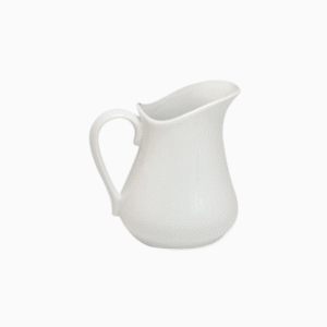 White porcelain ceramic milk jug for coffee and tea