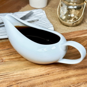 White ceramic kitchen jug and sauce server with handle