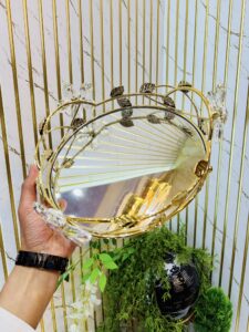 Round gold-toned mirrored decorative serving tray