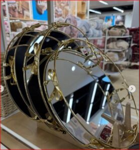 Round gold-toned mirrored decorative serving tray