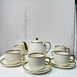 Luxury white ceramic tea set with gold handles and teapot