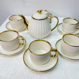 Luxury white ceramic tea set with gold handles and teapot