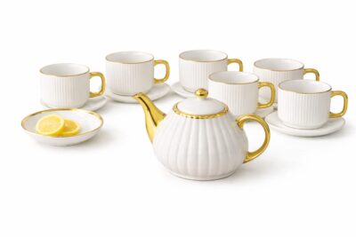 Luxury white ceramic tea set with gold handles and teapot